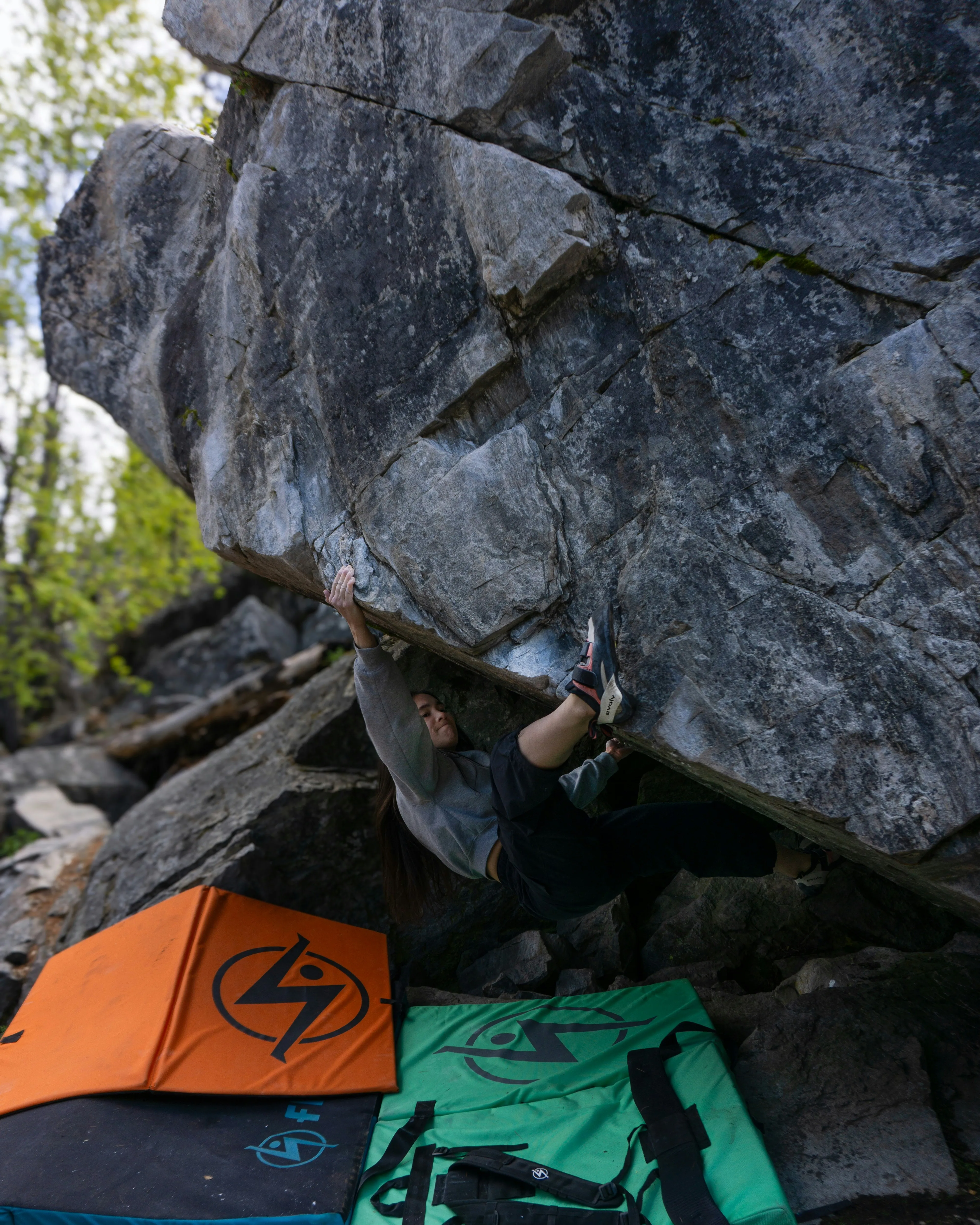 Cheyenne climbing a V6 boulder somewhere in Kelowna